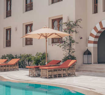 The swimming pool, chaise lounges and Umbrellas of Ali Pasha The s star Hotel in Marina Abu Tig El Gouna Red Sea Egypt
