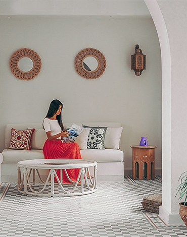 a girl enjoying the sun on a sandy beach