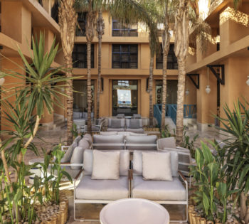 The coconut grove laidback open air sitting area at the heart of Sheraton Miramar Resort in El Gouna with an alfreso setting