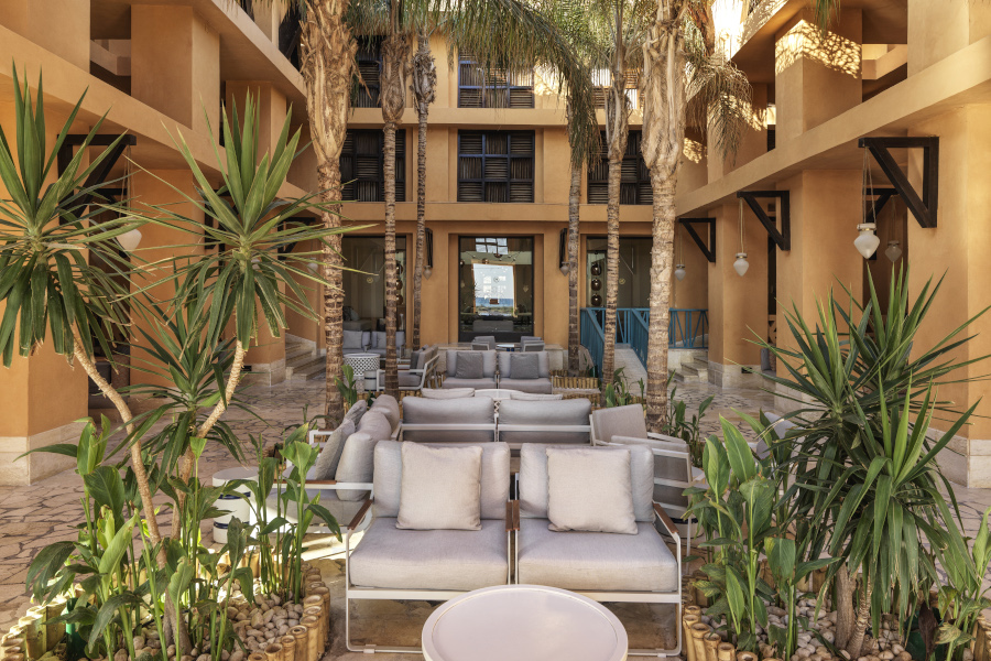The coconut grove laidback open air sitting area at the heart of Sheraton Miramar Resort in El Gouna with an alfreso setting