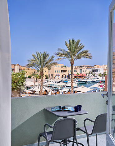 a girl enjoying the sun on a sandy beach