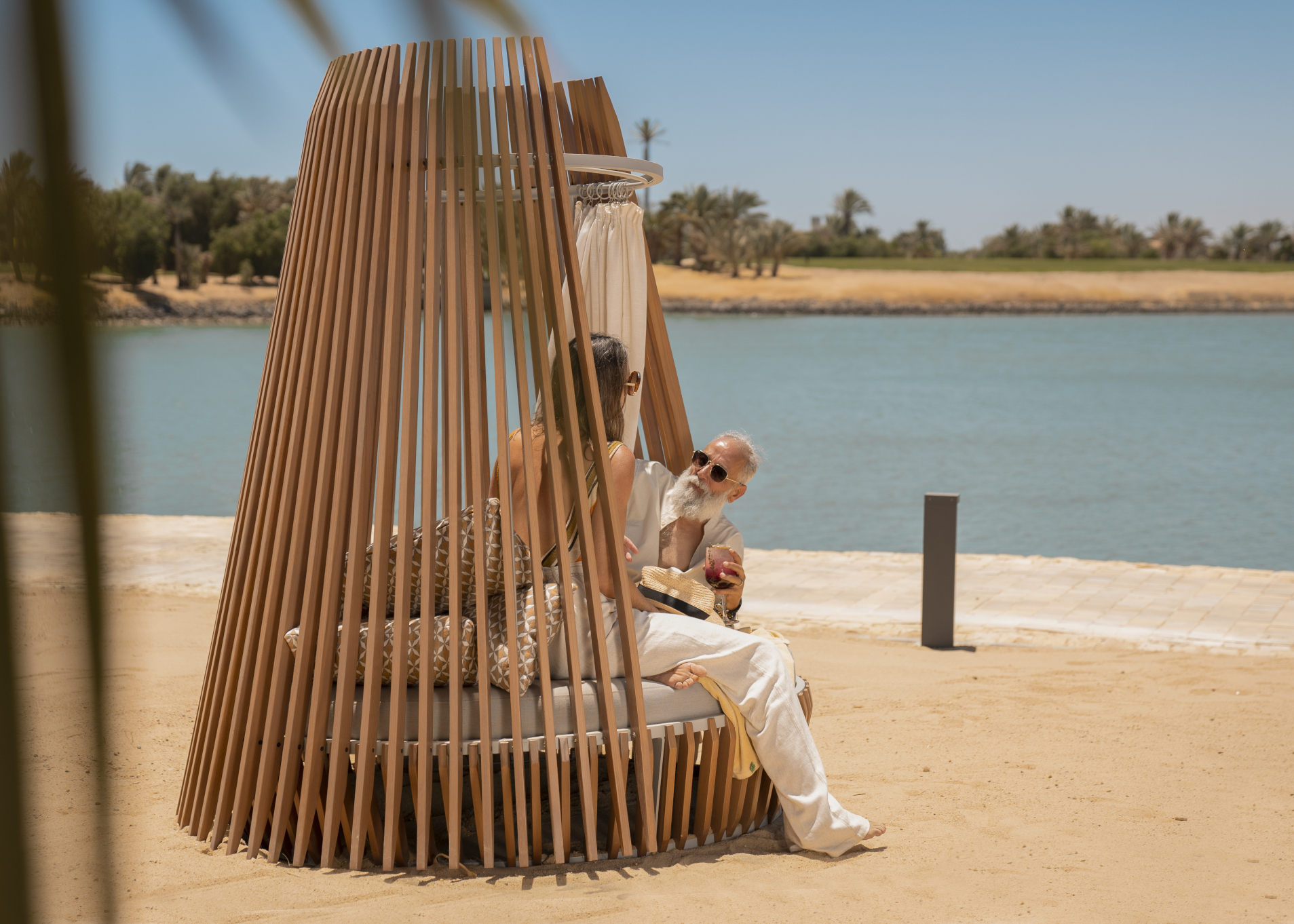 a man and a woman chilling on the beach at steigenberger el gouna