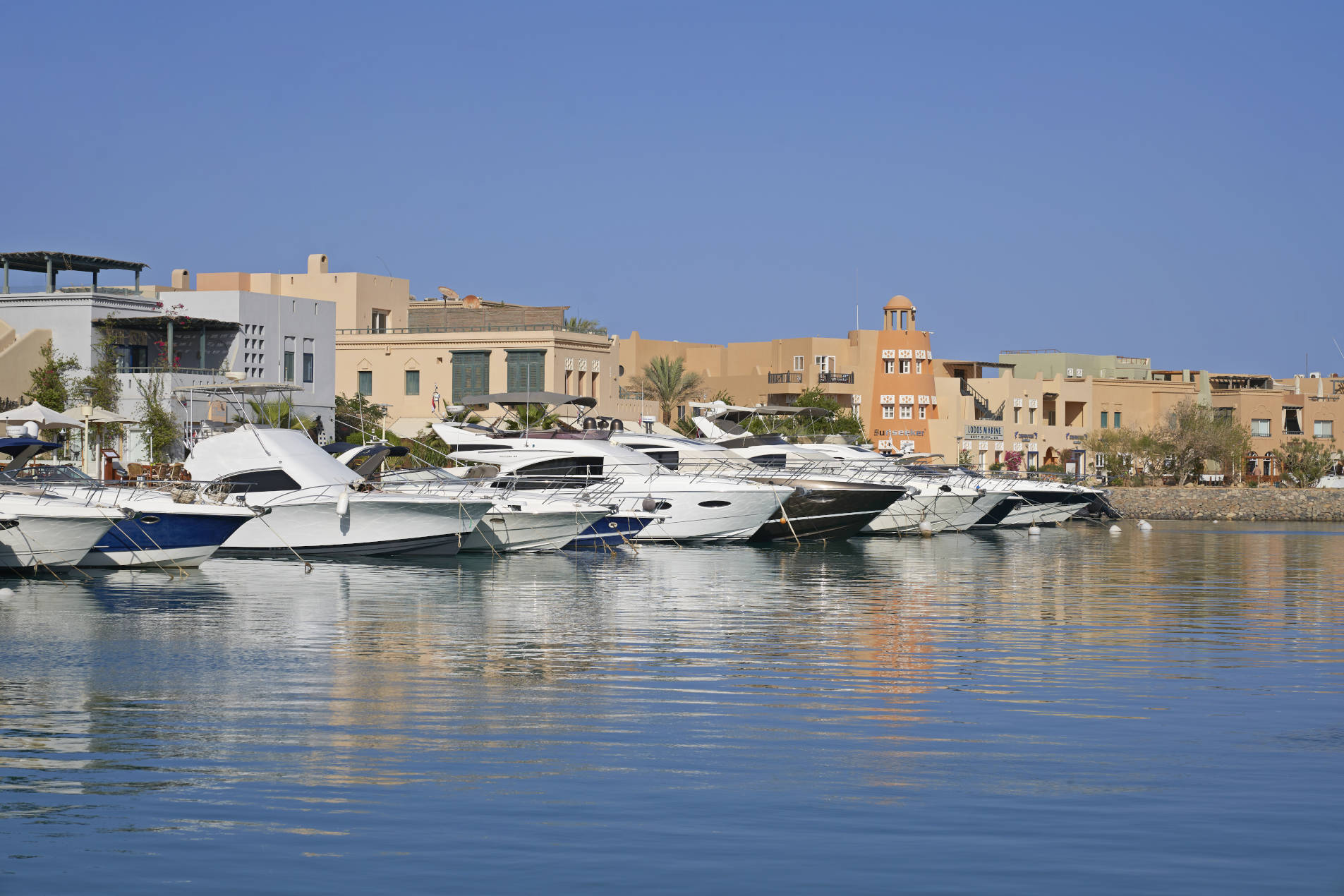Daytime view of Abu Tig Marina El Gouna from Turtle's Inn Marina view room terrace showing orderly parked yachts & redsea