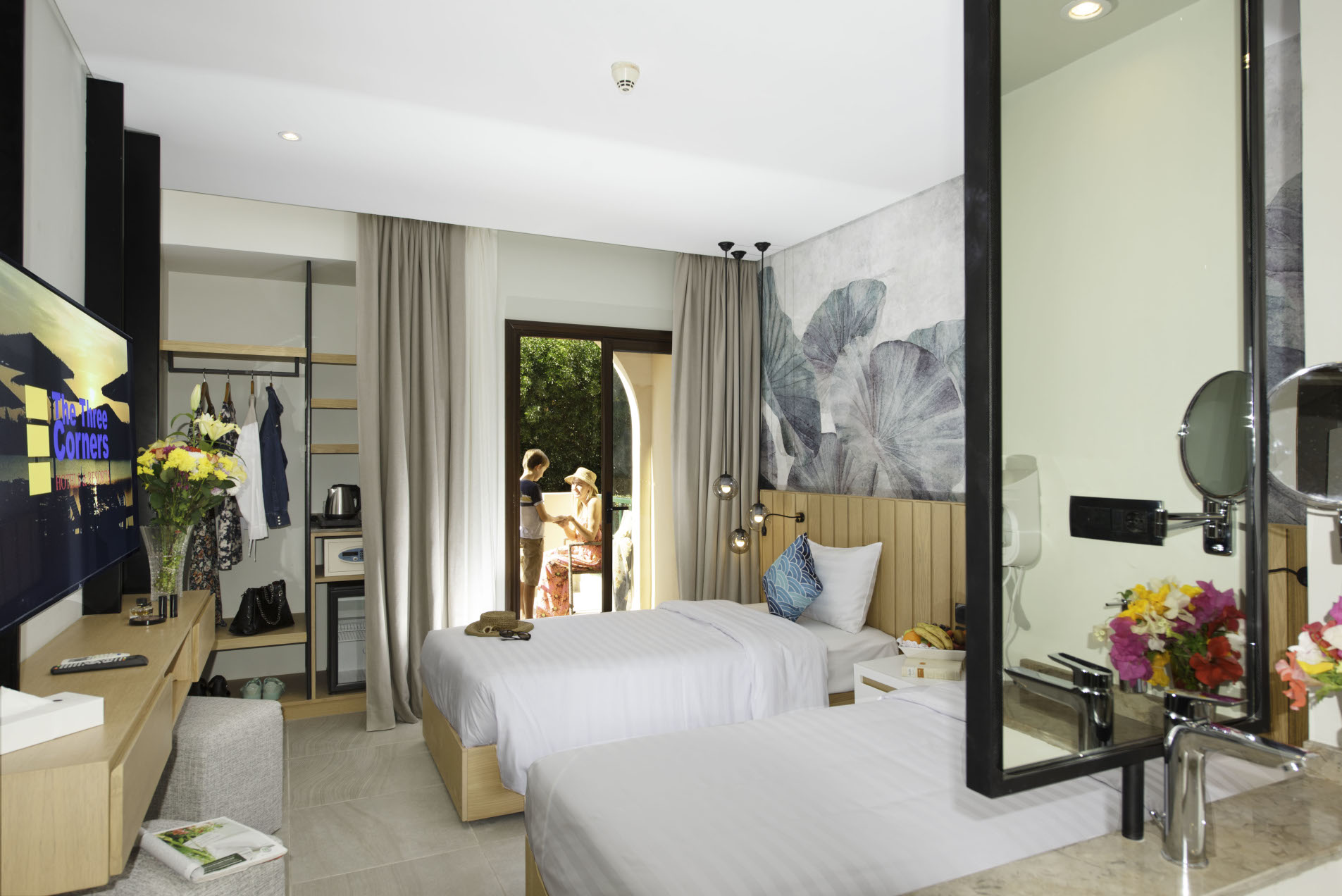 three corners rihana double bedroom with a woman and her child hanging out on the terrace