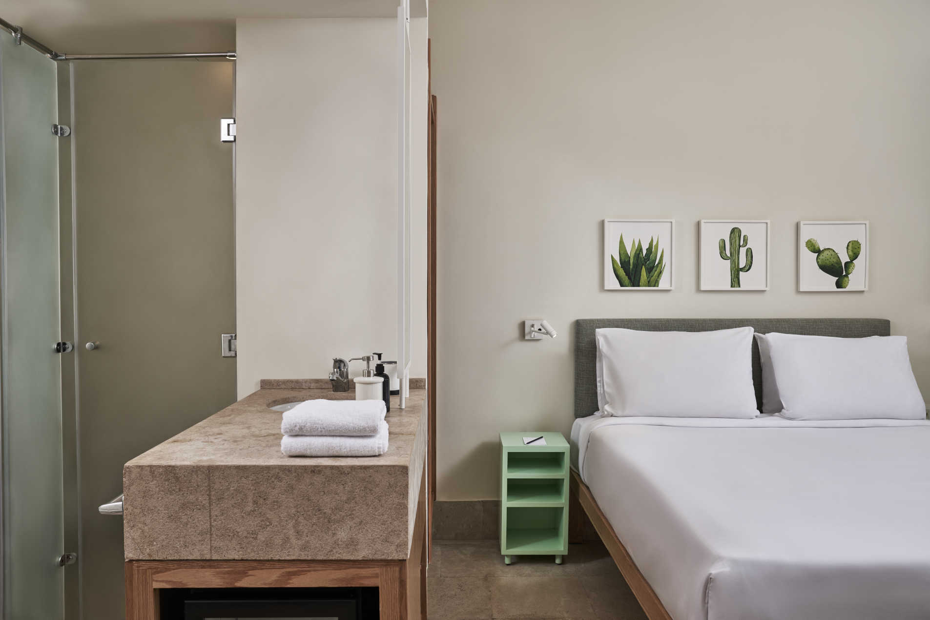 king bed in marina suite at captain's inn hotel el gouna with bathroom area