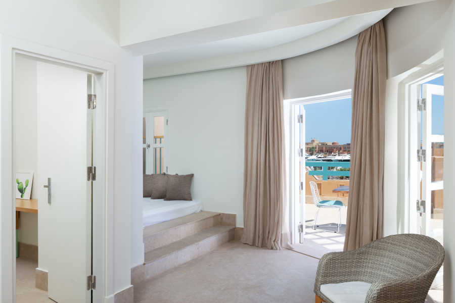 Captain's Inn Hotel Captain Suite with Modern floor bed & big terrace on the Abu Tig Marina El Gouna with seating table