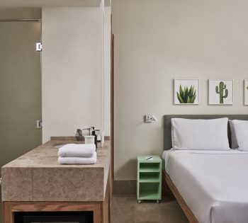 Captain's Inn El Gouna Red Sea Egypt Junior Suite King bed, mini bar also the Bathroom shower and basin appear on the left