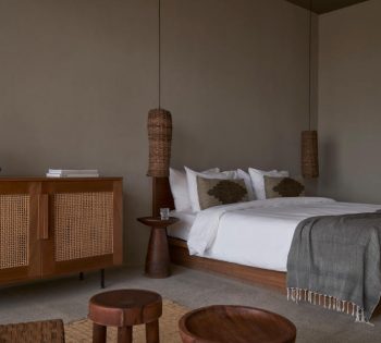 The spacious king-sized bedroom with built in sofa and a small tea table at Casa Cook hotel in Egypt