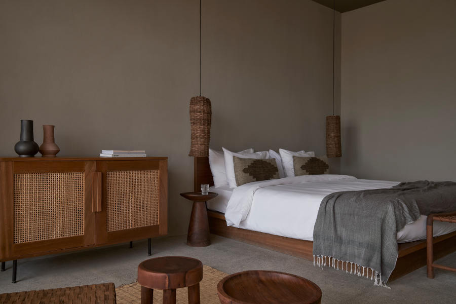 The spacious king-sized bedroom with built in sofa and a small tea table at Casa Cook hotel in Egypt