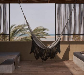 The outdoor terrace of premium room with 2 built in sofas that overlooking the blue crystal water of Red Sea at Casa Cook Resort in El Gouna Egypt