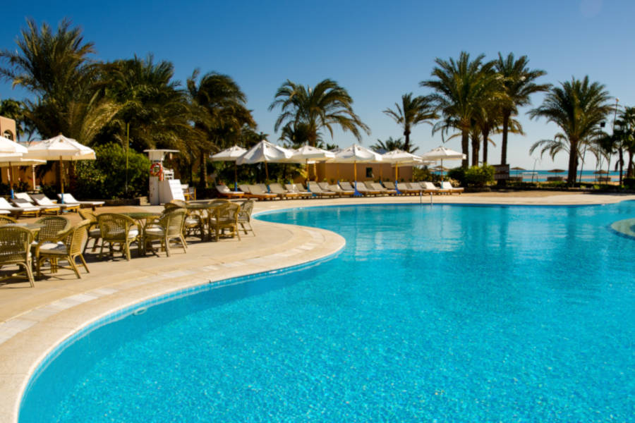 club paradisio main pool with a bar overlooking the pool for the hotel's guests