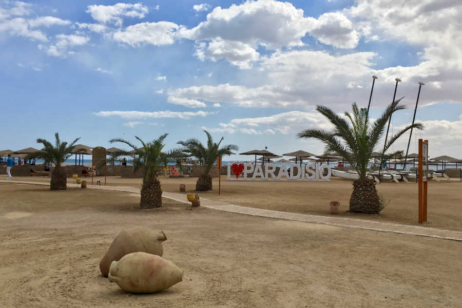 The sandy beach of Club Paradisio Hotel with beach bar that offers a wide range of drinks in El Gouna Hotels