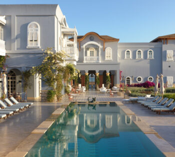 The outdoor swimming pool of La Maison Bleue luxury hotel in El Gouna that overlooking the blue waters of Red Sea