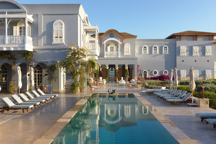 The outdoor swimming pool of La Maison Bleue luxury hotel in El Gouna that overlooking the blue waters of Red Sea