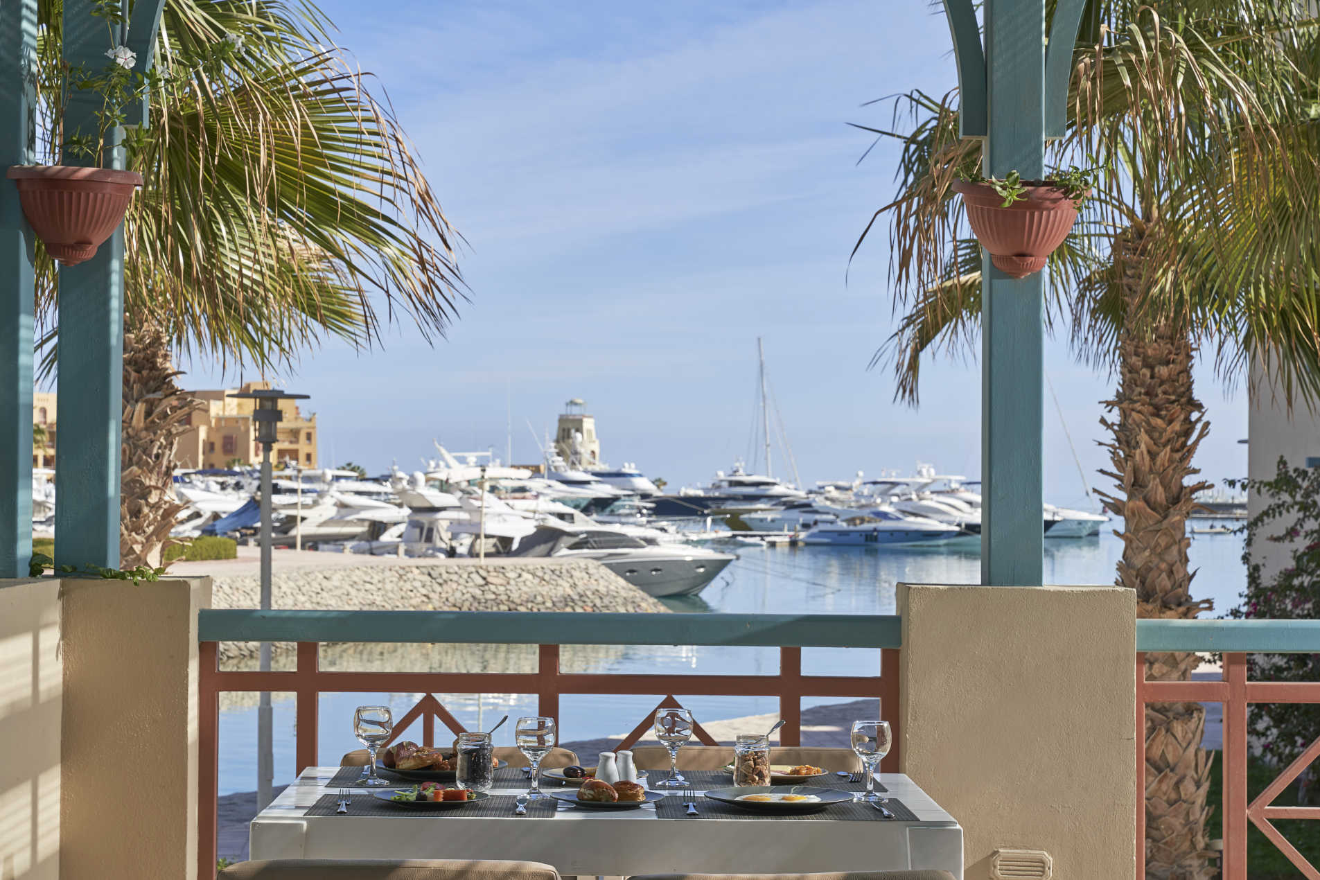 Breakfast at Mosaique hotel restaurant terrace with the fresh breeze of Red Sea and El Gouna Marina view