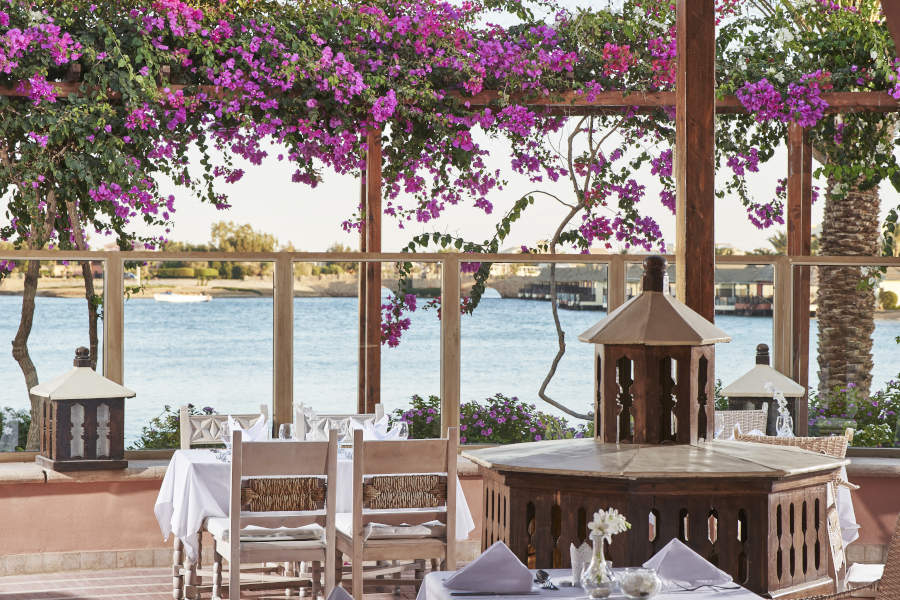 main restaurant's seating area at sultan bey hotel el gouna with lagoon view