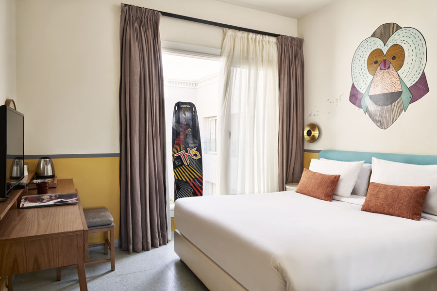 Turtle's Inn Hotel standard room with Wind theme, Room ameneities include flat screen TV, kettle with courtyard window view