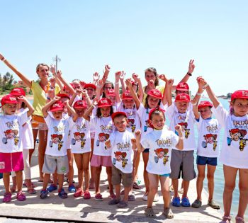 The kids feeling cheerful and wearing Trixie Kids Club t-shirts with the animation team in The Three Corners Rihana Inn and Rihana Resort in El Gouna