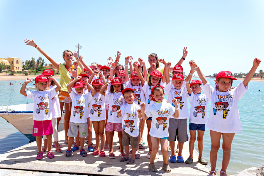 The kids feeling cheerful and wearing Trixie Kids Club t-shirts with the animation team in The Three Corners Rihana Inn and Rihana Resort in El Gouna