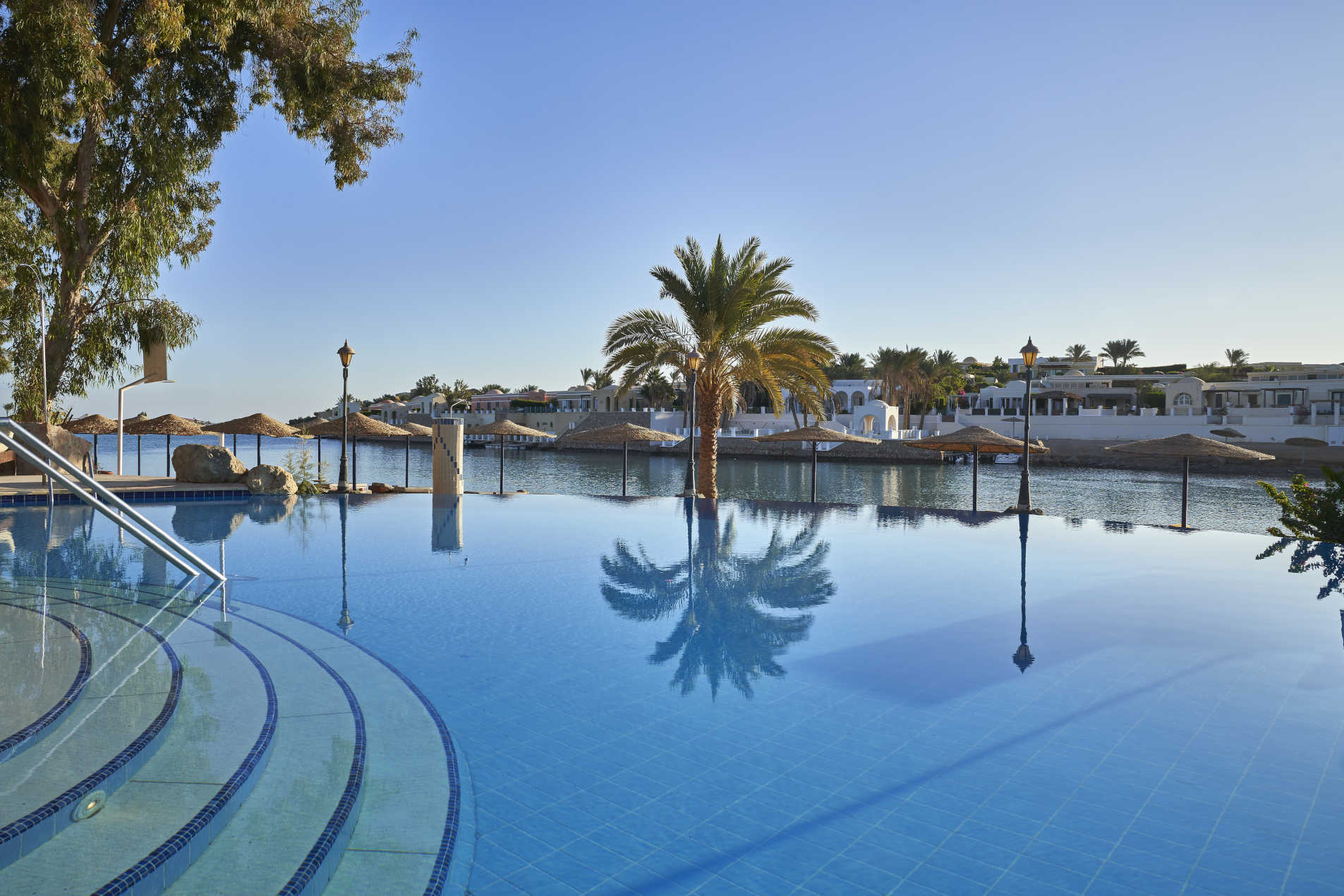 a view of sultan bey hotel adult pool and lagoon beach on daylight