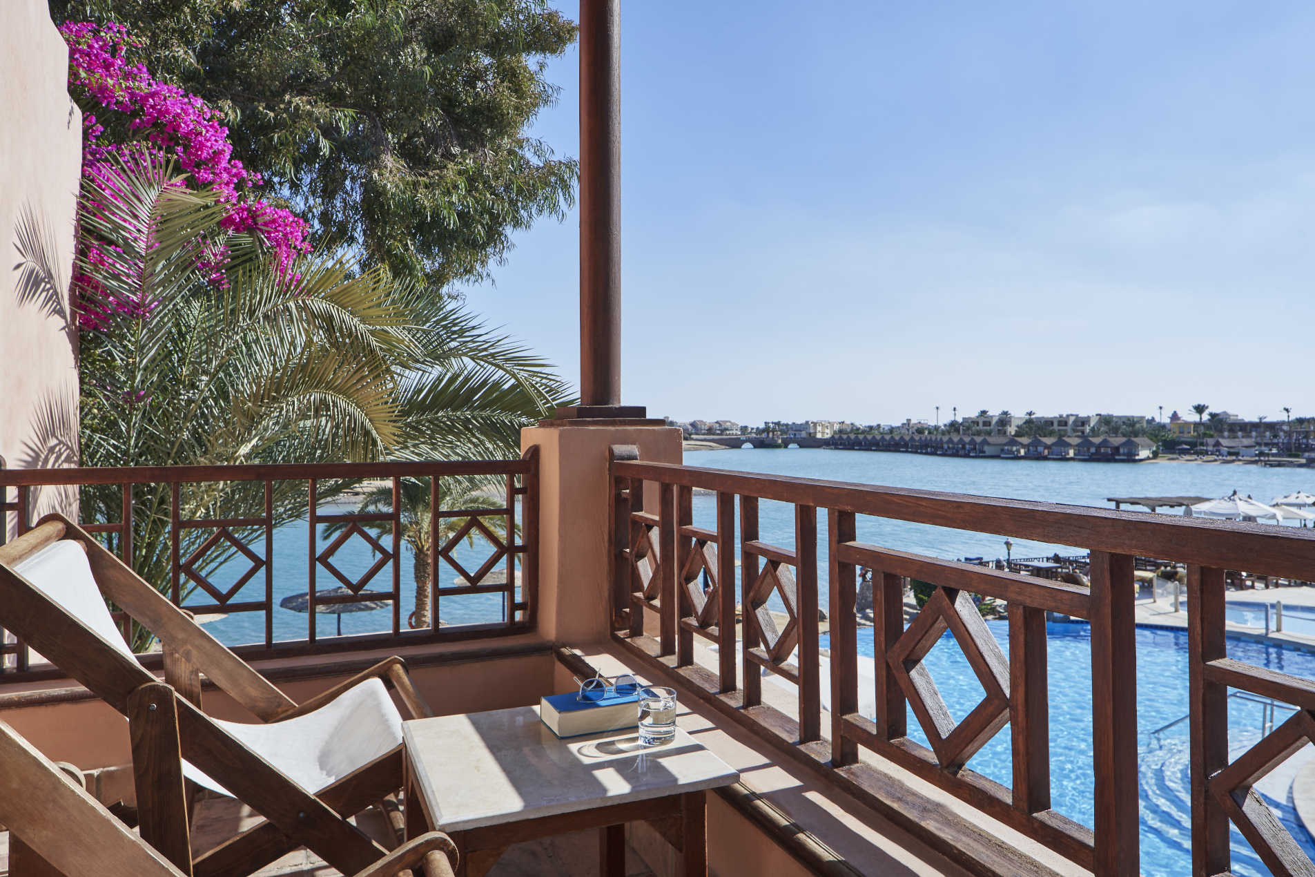 terrace area at sultan bey hotel with pool and lagoon view
