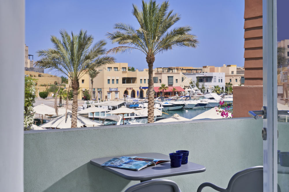 Daytime Abu Tig Marina View from Turtle's Inn Marina View Room, View includes beautiful Blue Redsea water, yachts & pier 88
