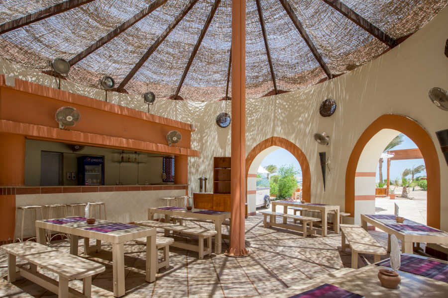 Restaurant outdoor sitting area of Zeytouna beach for Dawar El Omda Hotel Guests, Beach is 350 m long & has heated pools