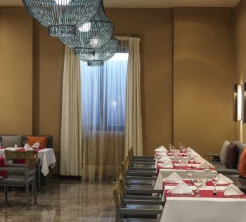 The dining tables of Dunes the main restaurant of Ancient Sands Resort in El Gouna Red Sea