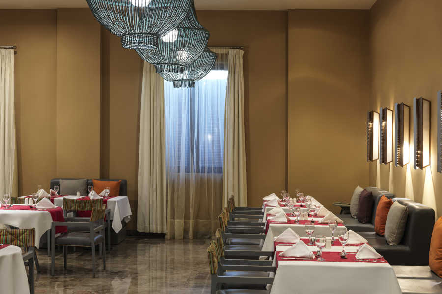 The dining tables of Dunes the main restaurant of Ancient Sands Resort in El Gouna Red Sea