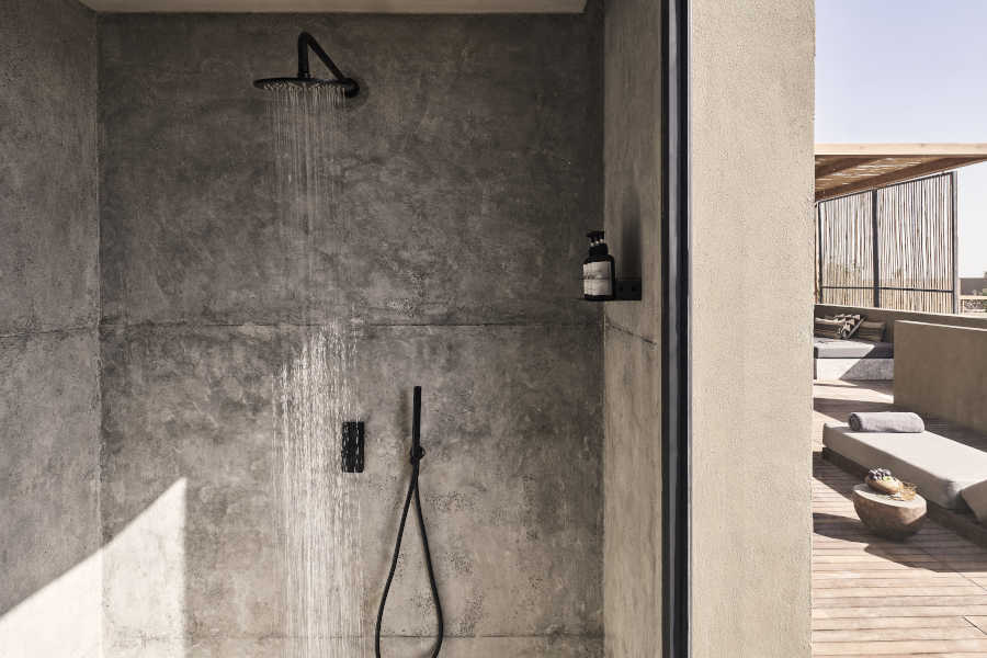 The shower of premium room in Casa Cook El Gouna Resort with a door connected the outdoor area