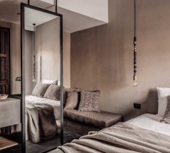 the overview of Cook's Club Hotel room showing a built-in sofa with a mirror in El Gouna Red Sea