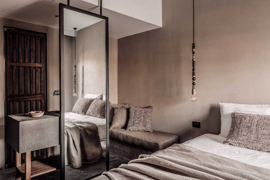 the overview of Cook's Club Hotel room showing a built-in sofa with a mirror in El Gouna Red Sea