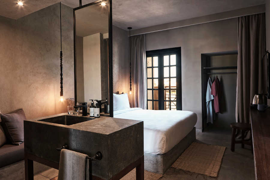 The overview of Lagoon View Room furnished with a king sized bed in Cook's Club Hotel El Gouna