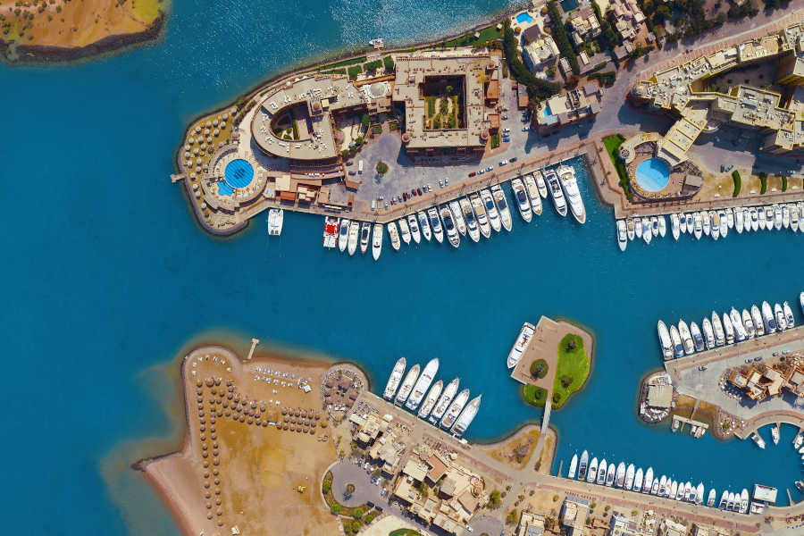 A bird eye overview for Abu Tig Marina in El Gouna showing the luxurious yachts, hotels, restaurants and bars
