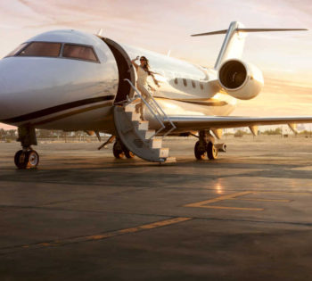 A lady is coming out of a private jet at El Gouna airport in Red Sea