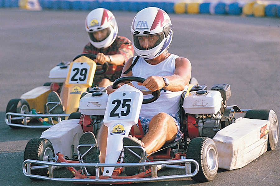 two men are go-karting in El Gouna go-kart track