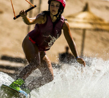 A girl is wakeboarding in El Gouna lagoons at Sliders Cable Park