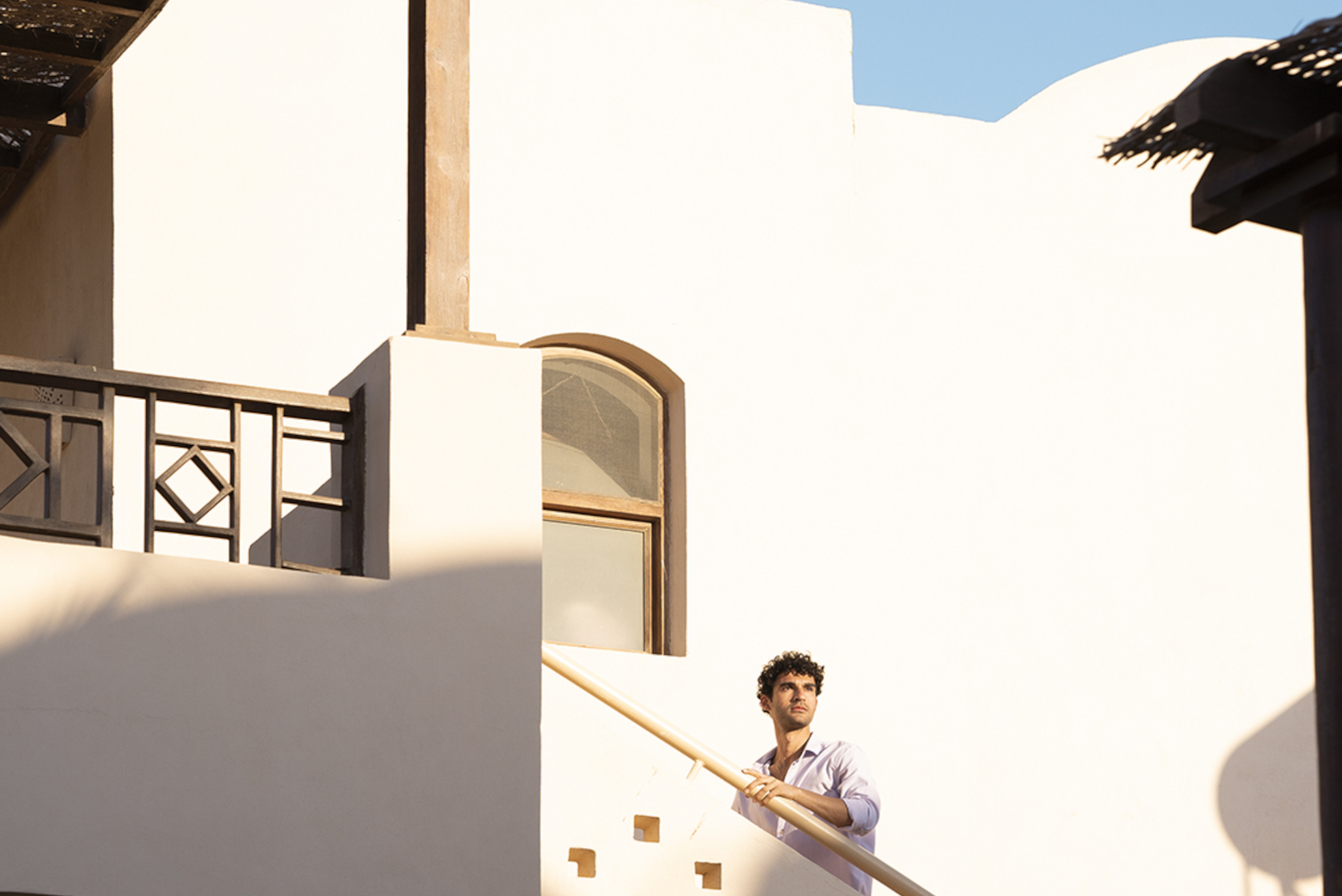 a guy going up the staircase at sultain bay el gouna hotel