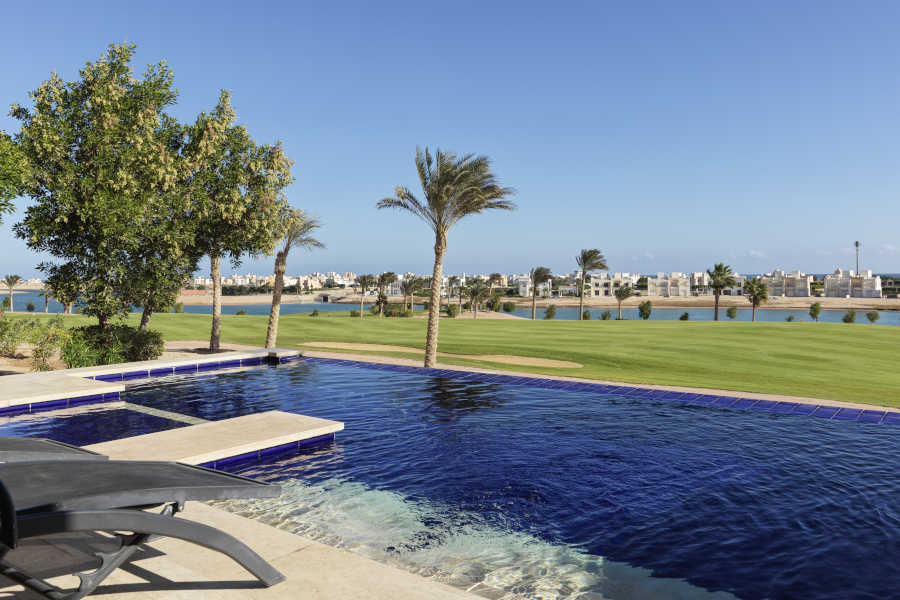The private swimming pool of the golf villa at Ancient Sands Golf Resort in El gouna that overlooking golf spaces and Red Sea lagoons