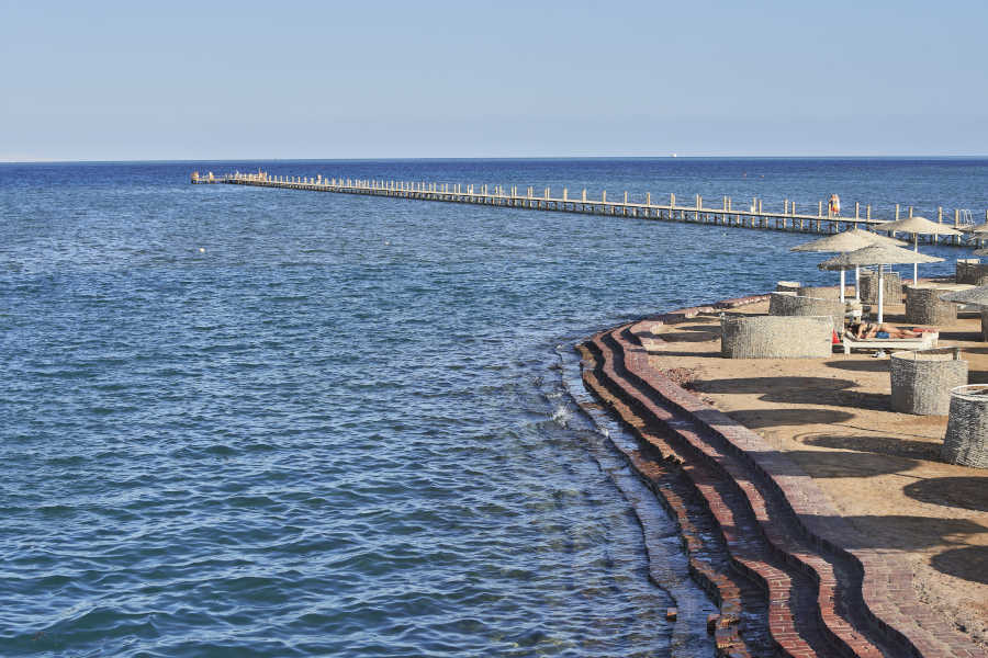 Zeytouna beach in El Gouna with jetty over Red Sea water and sunbeds