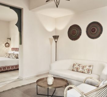 Newly rennovated suite of Ali Pasha Hotel El Gouna with a king bed, living area , arabesque style decorations