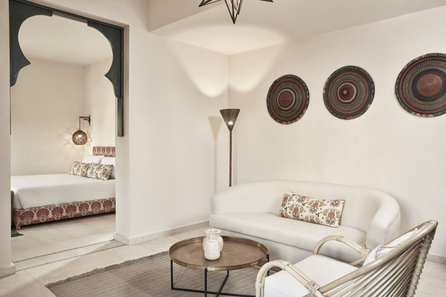 Newly rennovated suite of Ali Pasha Hotel El Gouna with a king bed, living area , arabesque style decorations