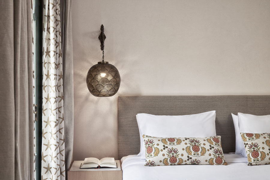 King Size Bed of Ali Pasha Premium Rooms with Hanging Arabesque design lamp used as over bed decoration