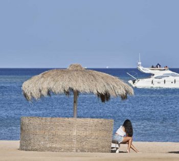 A lady chilling out at Marina Beach Club in El Gouna Red Sea