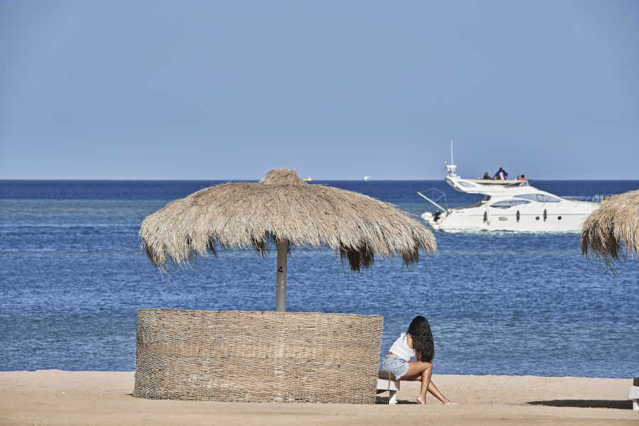 A lady chilling out at Marina Beach Club in El Gouna Red Sea
