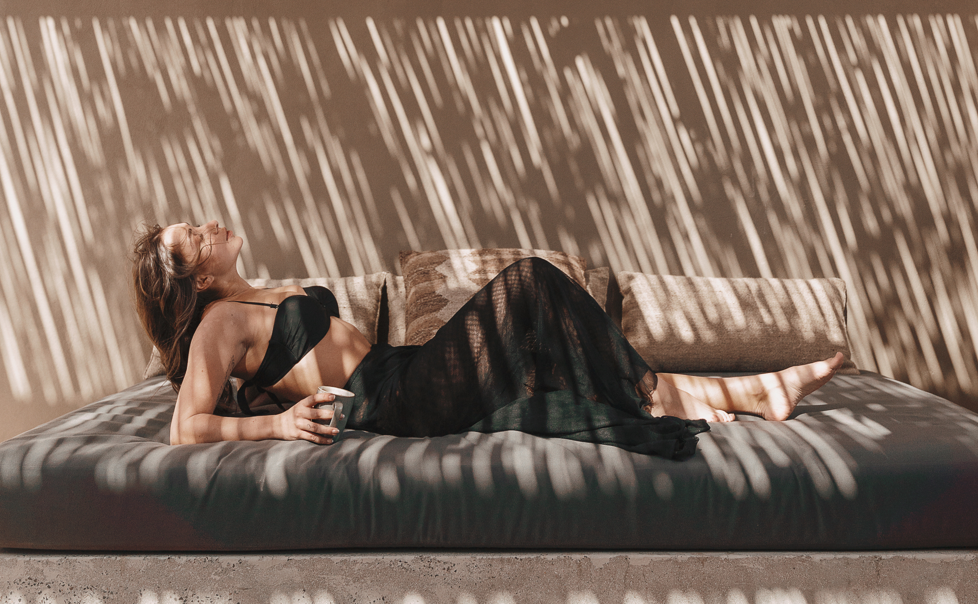 a girl chilling on the porch of her hotel room at casa cook