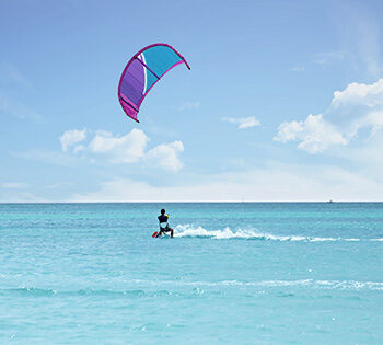 kitesurfer on red sea in el gouna with purple kite