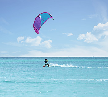 kitesurfer on red sea in el gouna with purple kite