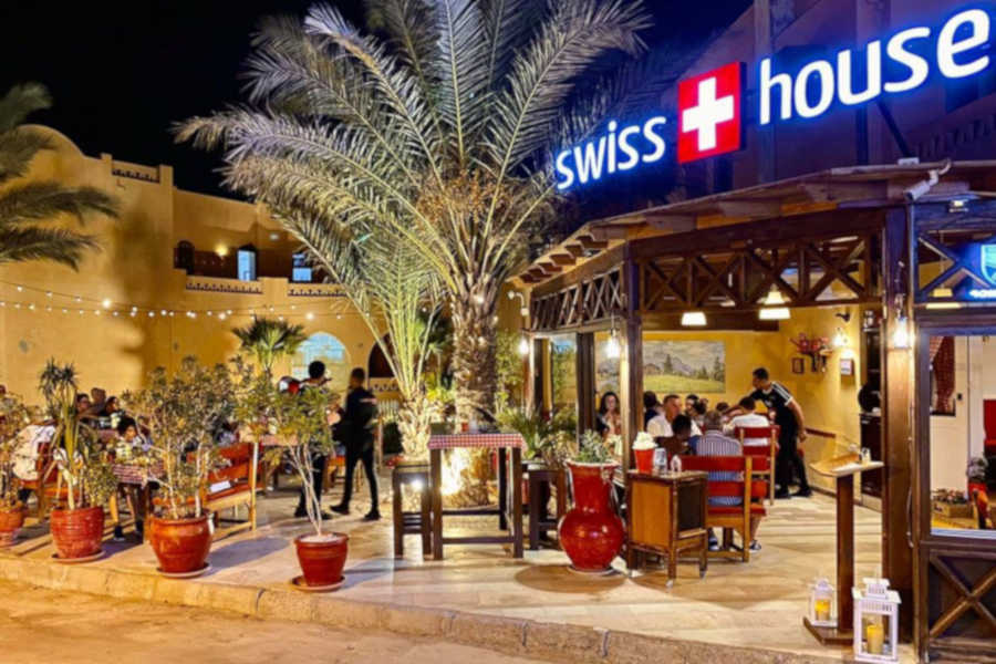 front view of swiss house restaurants in downtown el gouna
