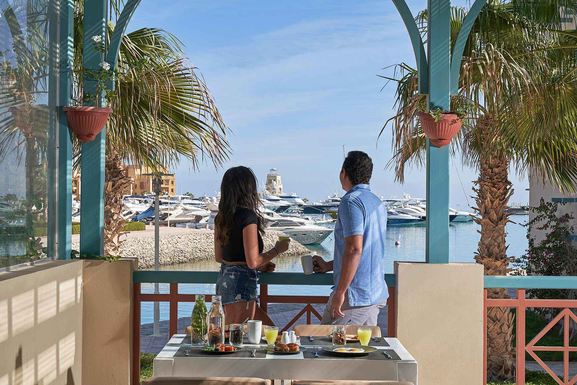 couple overviewing El Gouna marina from restaurant terrace